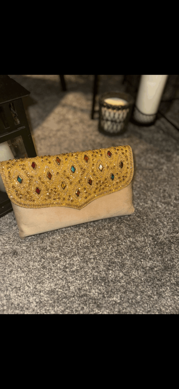 Multi-coloured cream clutch bag