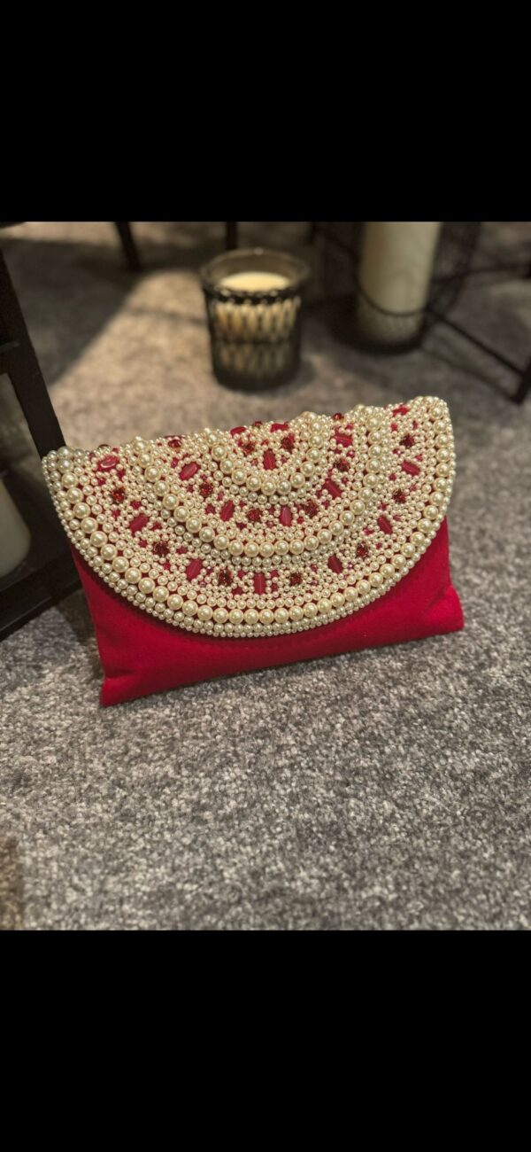 Red pearl clutch bag