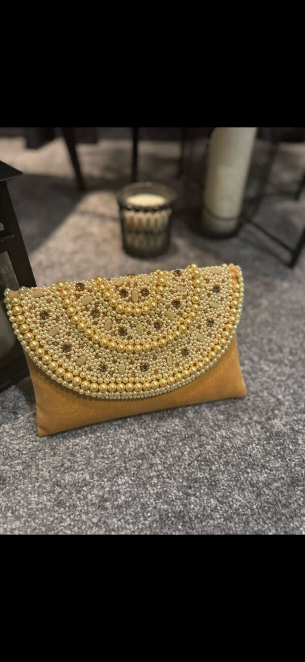 Gold pearl clutch bag